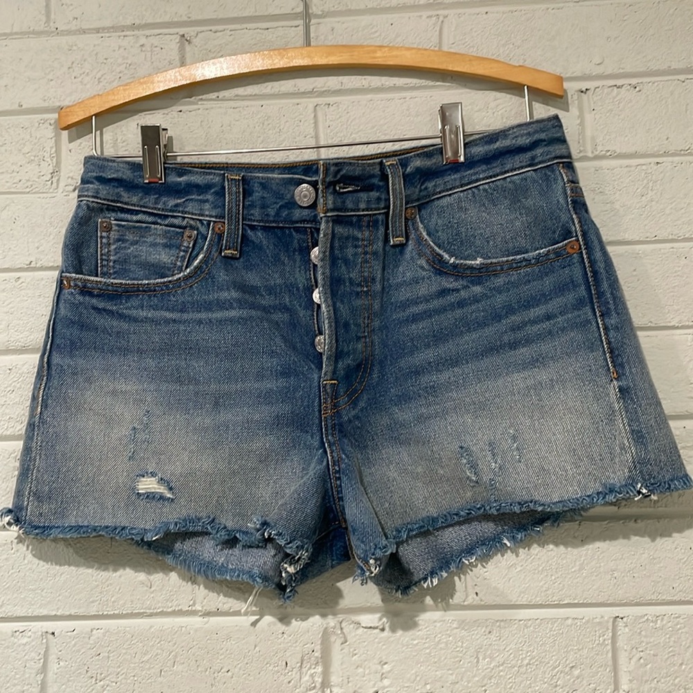 Levi’s slightly distressed button fly Jean shorts
